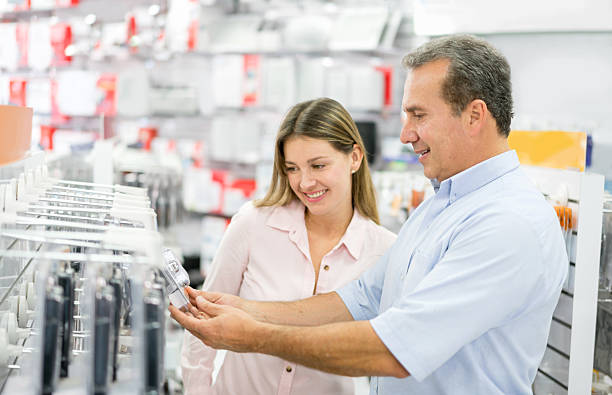 istock Woman shopping at an electronics store 525491178