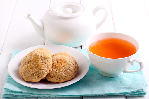 Homemade cookies and cup of tea on table
