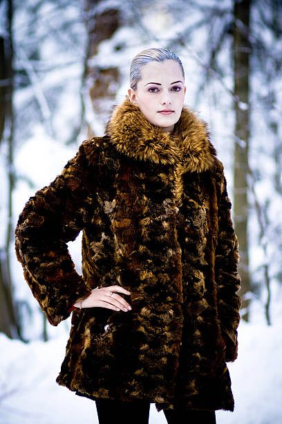 istock woman in cold winter park. 525494290