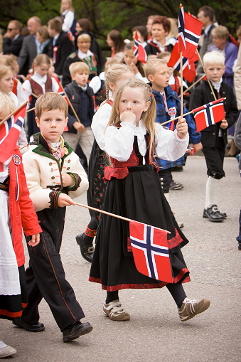 Oslo, Norway - May 17, 2010: National day in Norway. Norwegians at traditional celebration and parade on Karl Johans Gate street.