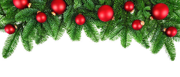 istock Lush fir twigs and red baubles on white 525495451