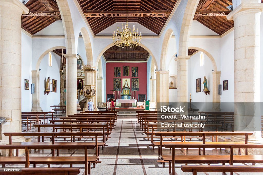 Typical Canary style white church building in La Oliva village La Oliva, Spain - November 19, 2014:  Church of Our Lady of La Candelaria in La Oliva, Spain.  The church is famous for its mudejar ceiling. Altar Stock Photo