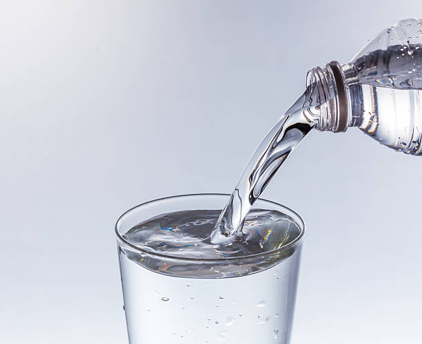 istock water being poured into glass 525496990