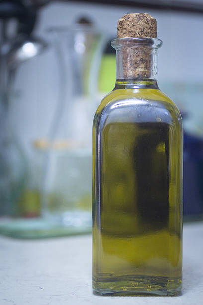 istock Bottle of extra virgin olive oil in kitchen 525497921