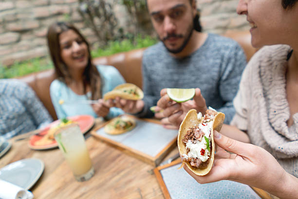 istock Friends eating at a Mexican restaurant 525498410