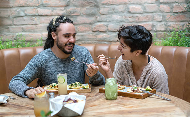 istock Happy couple eating at a restaurant 525498412