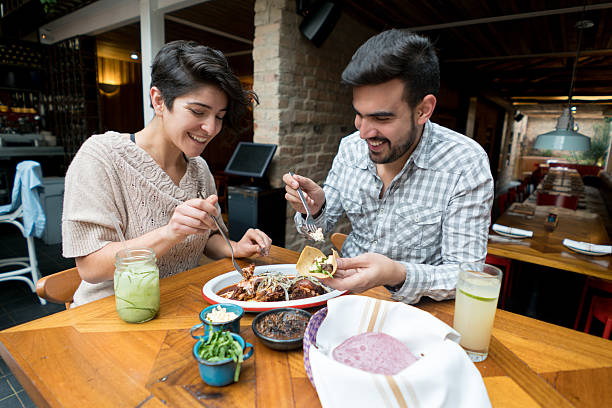 istock Couple eating at a Mexican restaurant 525498488