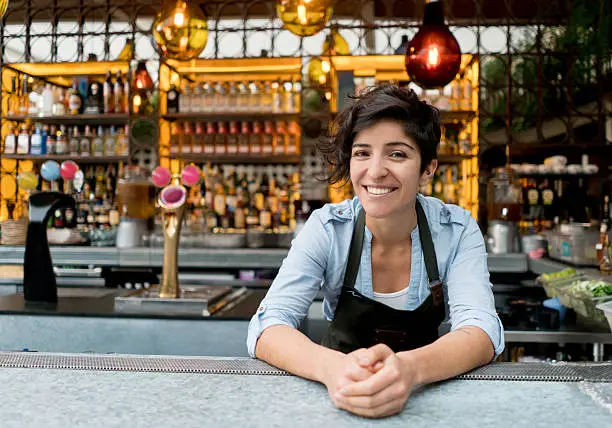 Photo of Barman working at a bar