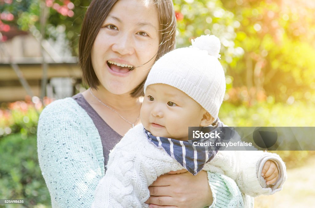 Young mom and her cute baby Adult Stock Photo