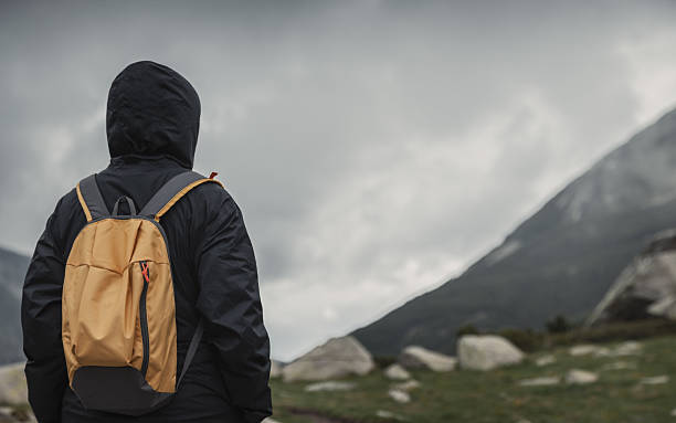 istock Traveler walking alone in the mountains 525500618