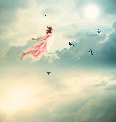 Blonde Girl Flying with Butterflies at Twilight