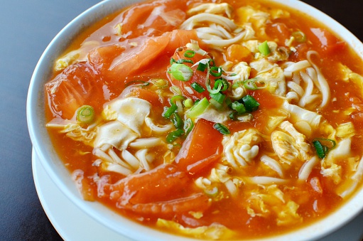 Chinese noodles in soup, with tomato, eggs and green onions