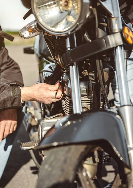 istock Senior man repairing damaged motorcycle engine 525501226