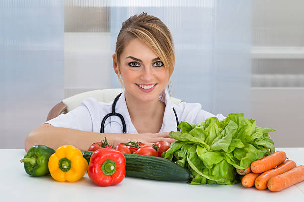 istock Female Dietician With Vegetables 525501608