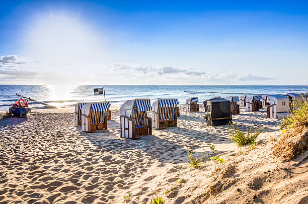 Beach chairs after sunrise Beach chairs in the morning after sunrise german north sea region stock pictures, royalty-free photos & images
