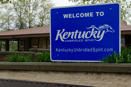 Covington, Kentucky, USA - April 22, 2016: A sign welcoming visitors to the state of Kentucky near the Ohio border.