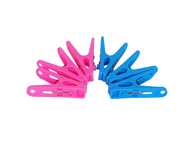 istock pink and blue clothespin on white background 525502405