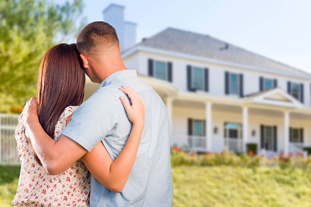 istock Military Couple Looking at Nice New House 525502869