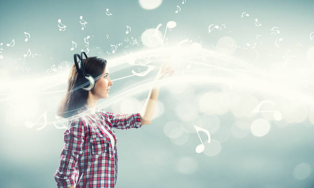 istock Girl with headphones 525507327