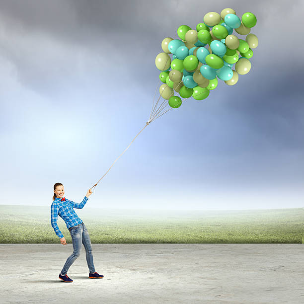 istock Woman with balloons 525509013
