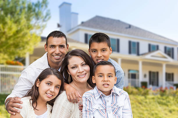 istock Hispanic Family in Front of Beautiful House 525510321