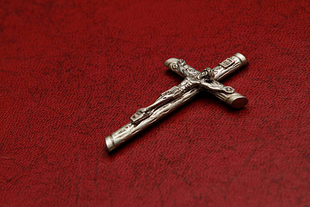 istock Little cross on red leatherette 525511291