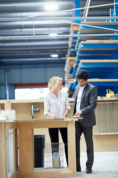 istock Young businessman reporting production status to senior manager 525512133