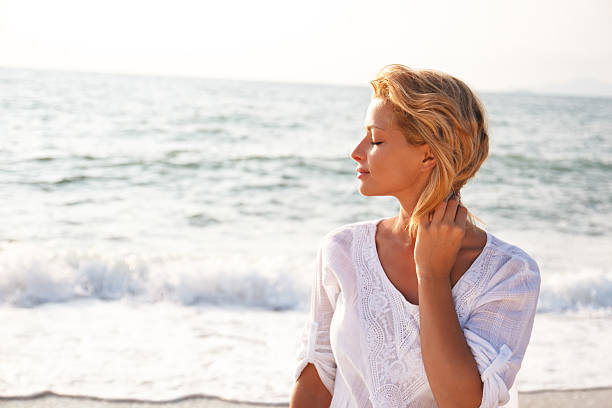 istock Attractive woman on the beach 525512399