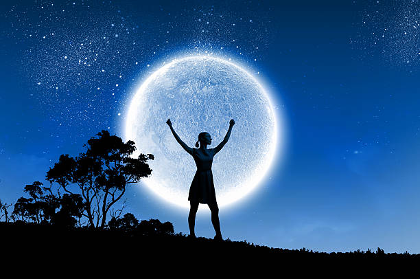 istock Woman and full moon 525512897
