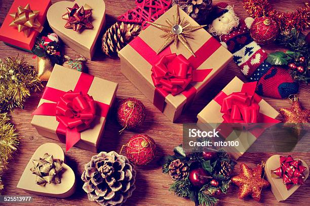 Christmas Gifts And Ornaments On A Rustic Wooden Table Stock Photo - Download Image Now