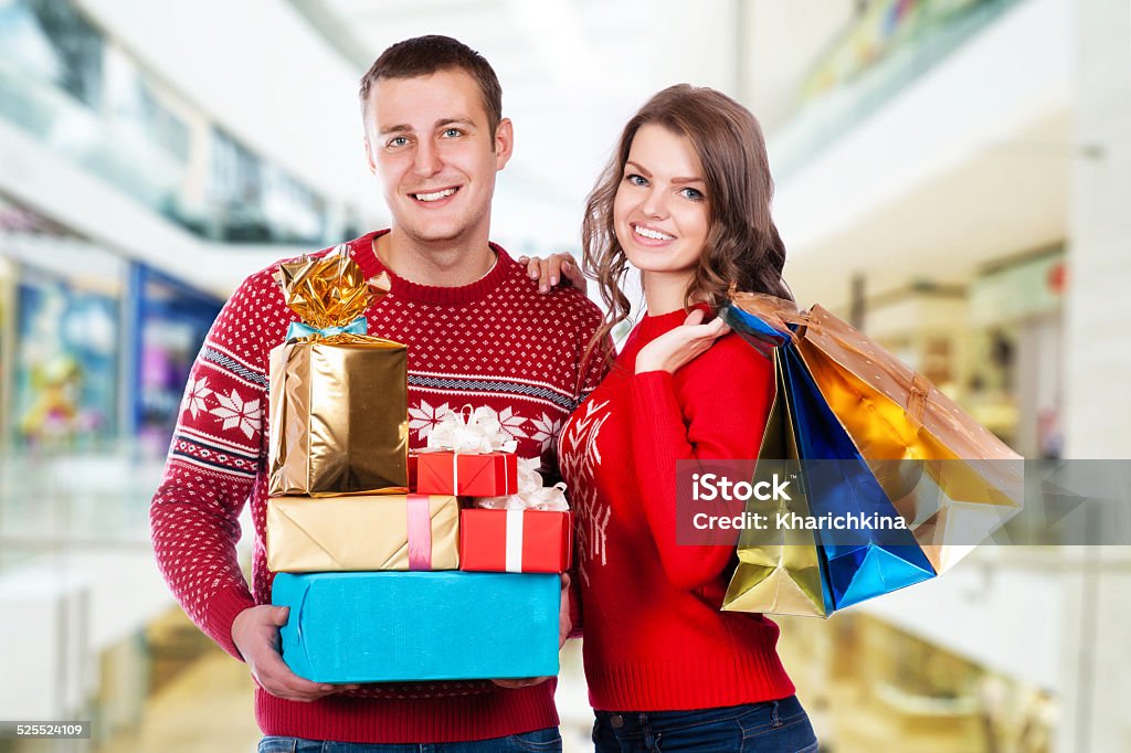 Portrait of happy couple with Christmas presents Adult Stock Photo