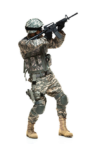 istock Army soldier aiming with machine gun 525525881