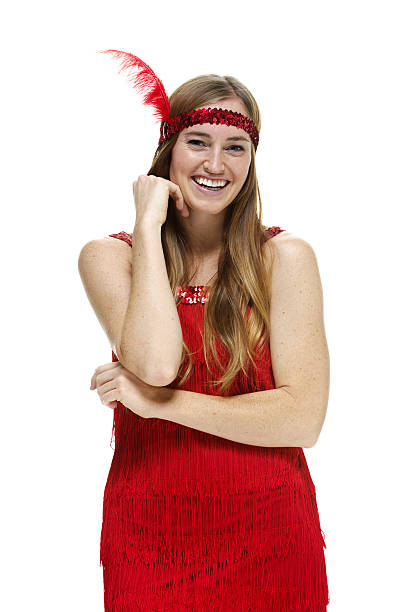 istock Cheerful female in flapper dress & looking at camera 525526879