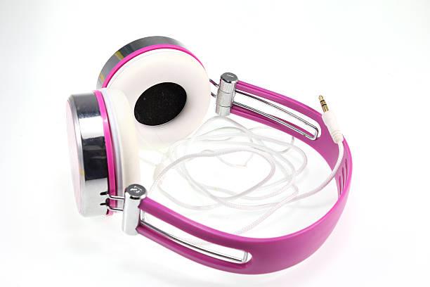 istock Purple headphones on white background 525527401