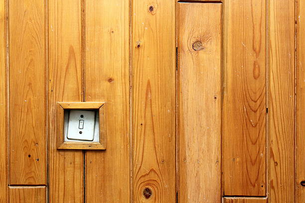 istock old electric switch on wooden wall 525528711