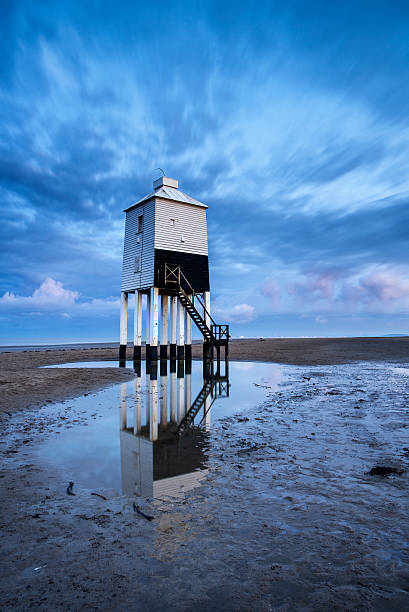istock Beautiful landscape sunrise stilt lighthouse on beach 525529595