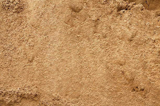 istock Texture of old wall covered with yellow stucco 525529613