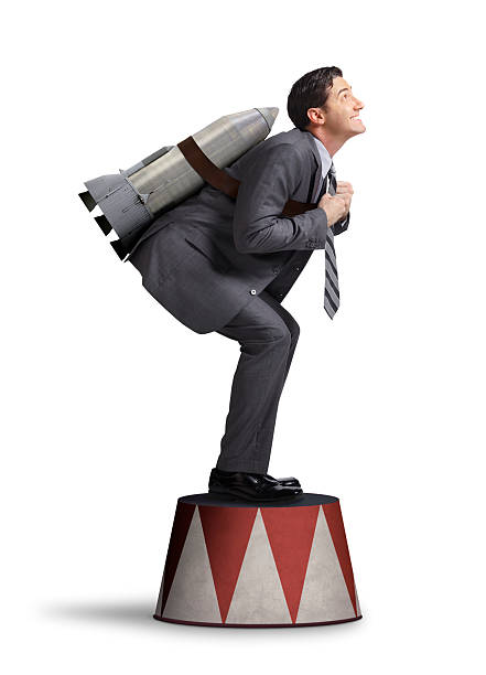 istock Businessman Preparing For Take Off On Circus Pedestal 525529753