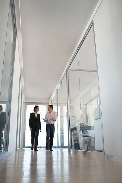istock Business People Walking In Hallway 525530347