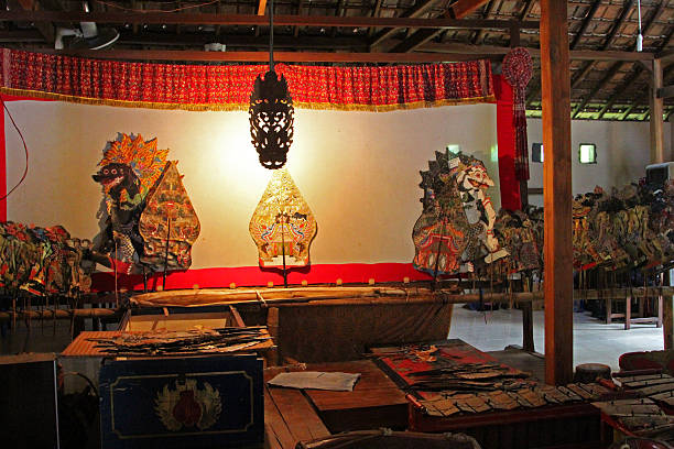 Indonesia: Javanese Shadow Puppet Theatre Yogyakarta, Indonesia - August 15, 2014: Backstage at a Javanese wayang kulit (shadow puppet) theatre in Yogyakarta. Performances of shadow puppet theatre are accompanied by a gamelan orchestra in Java. It is an ancient tradition throughout Java and all of Indonesia. wayang kulit photos stock pictures, royalty-free photos & images
