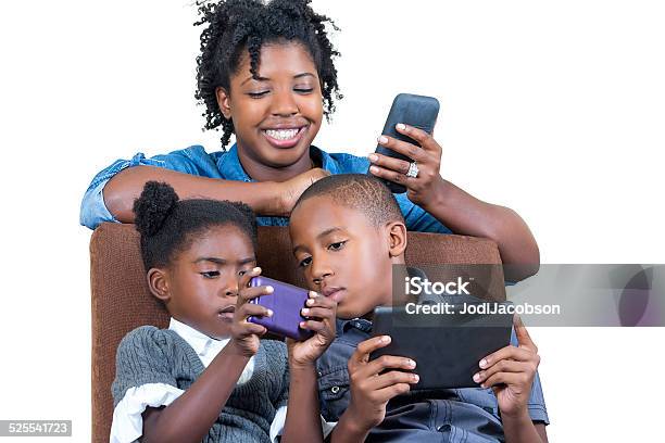 African American Mother With Her Children Using Cell Phones Stock Photo - Download Image Now