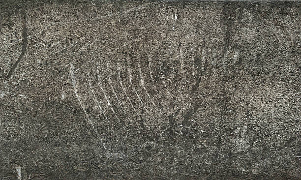 istock Texture of scratched gray granite wall 525542019