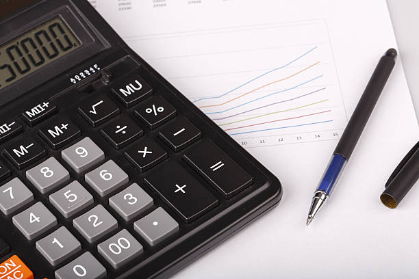 istock Business Charts with calculator and pen 525543365