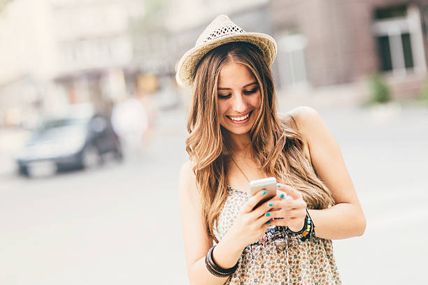 istock Happy woman texting on the phone 525543759