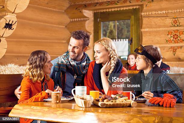 Family Having Lunch In Restaurant After Skiing Stock Photo - Download Image Now - Apres-Ski, Restaurant, Comfortable