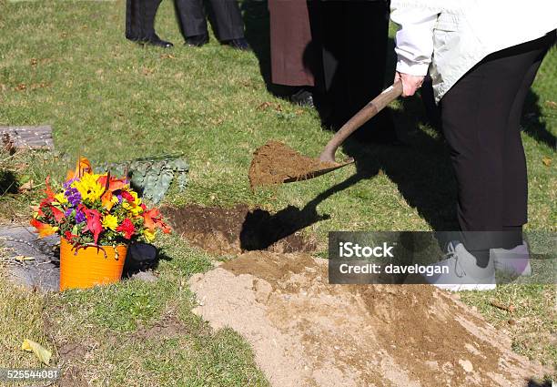 Burying Someones Ashes At A Graveside Service Stock Photo - Download Image Now - Ash, Burying, Cemetery