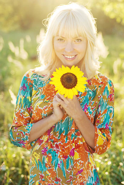 istock Woman with sunflower 525544785