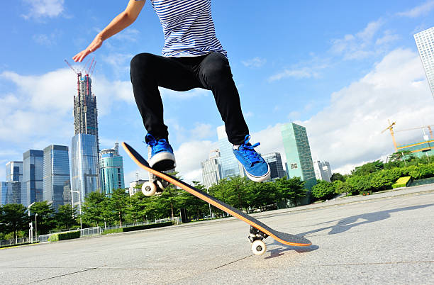 istock skateboarding woman jumping 525546045