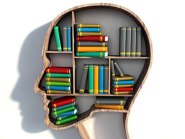 istock book shelf in form of head on white backgrounds 525546843