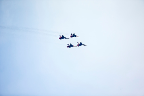 Belgrade, Serbia - October 16, 2014: Russian aerobatic MIG 29 airplane, part of the Swifts (Strizhi) group flying during a military parade in Belgrade. Russian President Vladimir Putin attended the parade which marked 70th anniversary of Belgrade's liberation from Nazi occupation. More than 3,000 soldiers took part in the military parade.